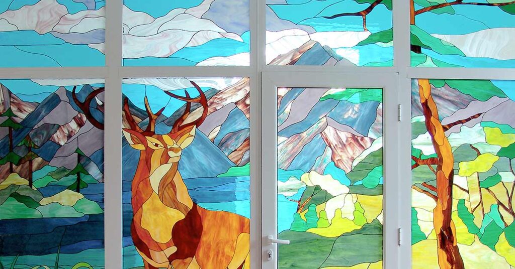 stained glass deer head: mountain scene stained glass