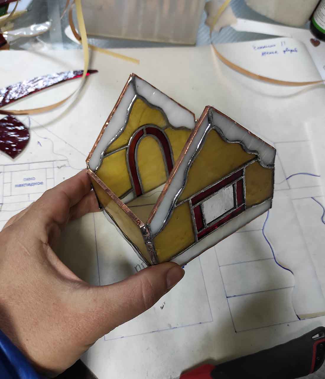 Stained glass house: showcasing the assembled box of a stained glass house without the roof