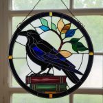 The wise raven standing in book