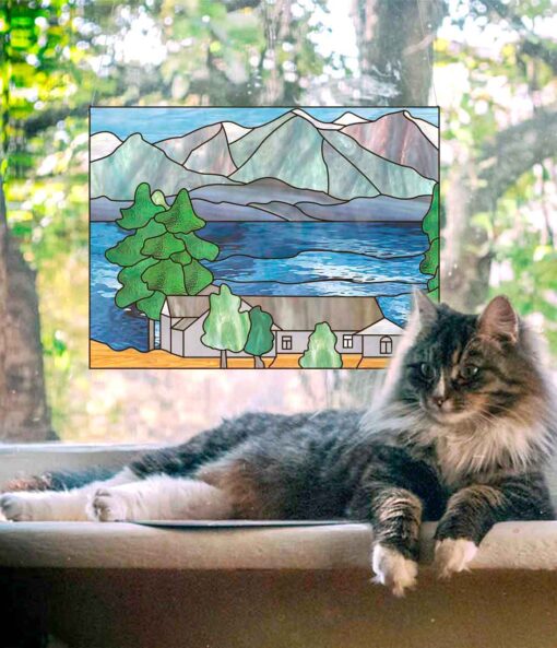 cat and stained glass mountain scene