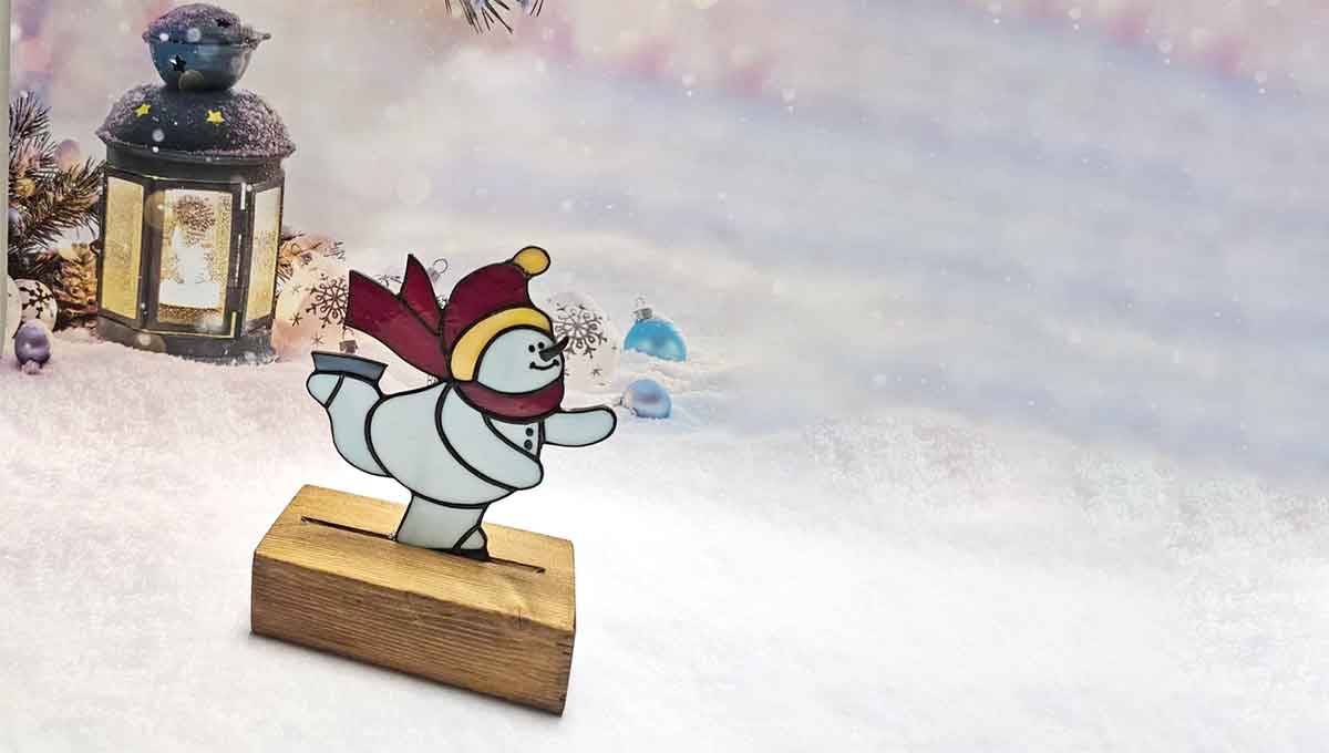 stained glass snowman on skates