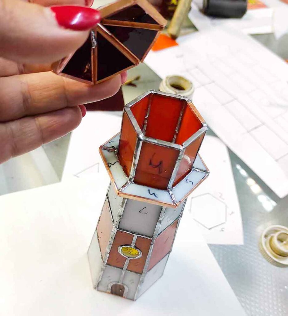 Assembling the roof and tower of the lighthouse together