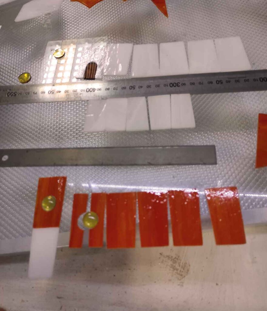 Cut pieces of glass for assembling the lighthouse