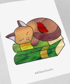 Alternative view of Tired Stained Glass Cat Rests on Library Books