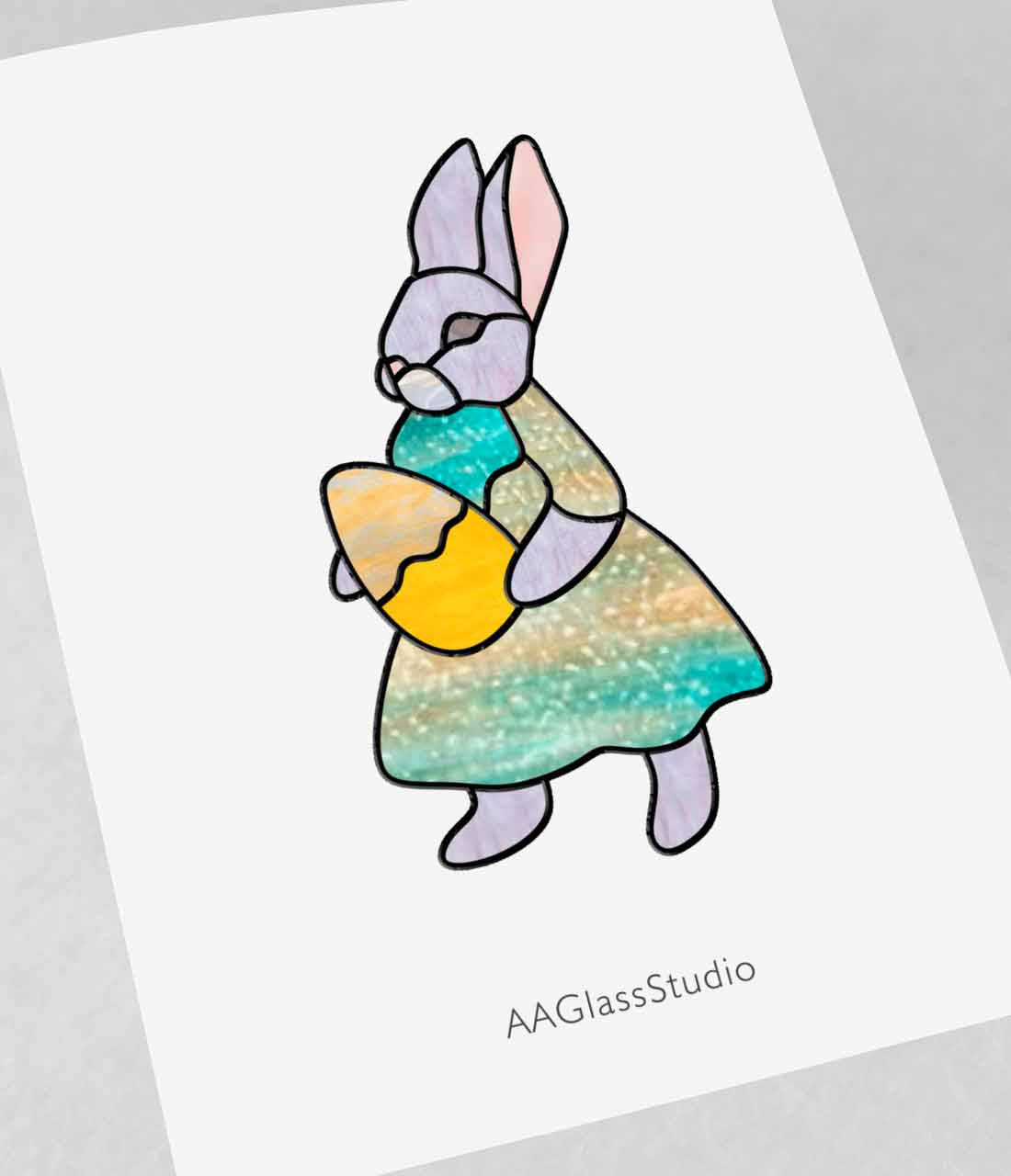A bunny dressed in a dress and carrying an Easter egg. Bunny stained glass pattern