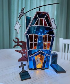 LED haunted house night light, creating an eerie orange and purple glow for a haunted mansion effect.