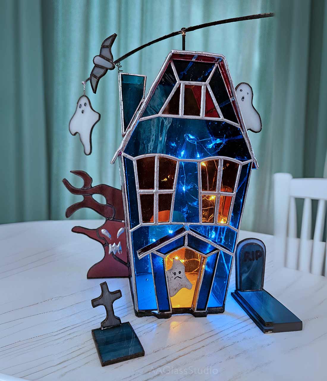 LED haunted house night light, creating an eerie orange and purple glow for a haunted mansion effect.