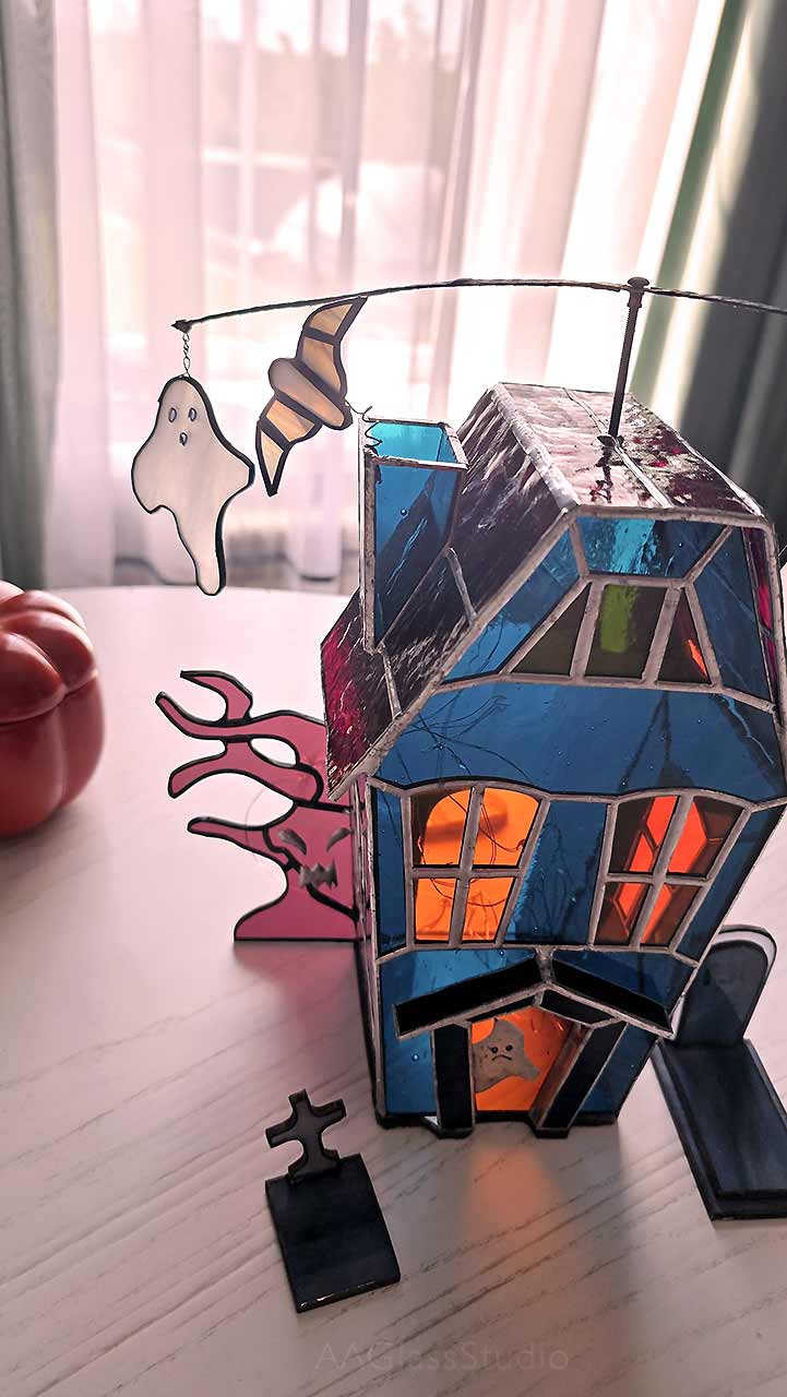 Halloween decor glowing beautifully on a windowsill, a creepy and cute addition to your home.