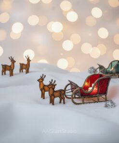 Stained glass display with elegant red sleigh in foreground and green sleigh in the background.
