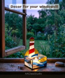 3D lighthouse memorabilia piece that functions as a light box stained glass decor and one of the unique stained glass candle holders, with a candle glowing inside the box.