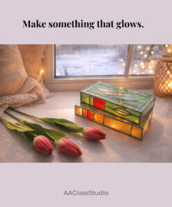 A stained glass stacked books lamp placed on a windowsill, showcasing intricate 3d stained glass craftsmanship with natural light glowing through the colorful glass layers.