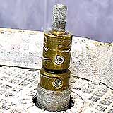 Two diamond bits mounted on one grinder shaft