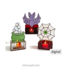 Group of three lit 3D Halloween stained glass candle holders: purple bat green cauldron and spider web