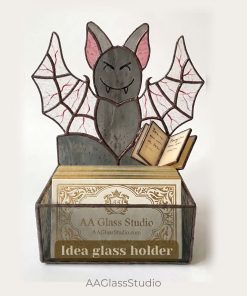 Stained glass bat used as a business card holder at a craft fair display
