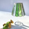Displaying a beautiful green stained glass lampshade on a wine glass.