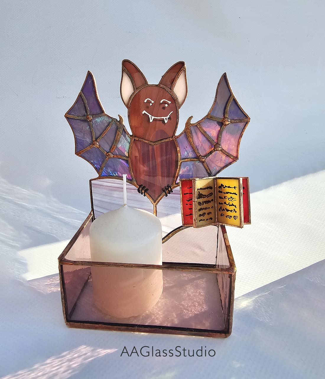 vintage stained glass candle holder a bat with a book of spells