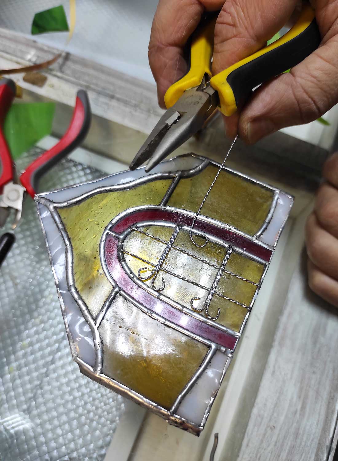 Making wire decorative details for stained glass house door and windows