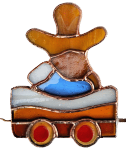 Stained glass suncatcher wagon with a gingerbread man, the tallest piece of the stained glass Christmas train