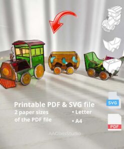 3D stained glass train locomotive and wagons beside printed PDF and SVG pattern pages on US Letter and A4 paper